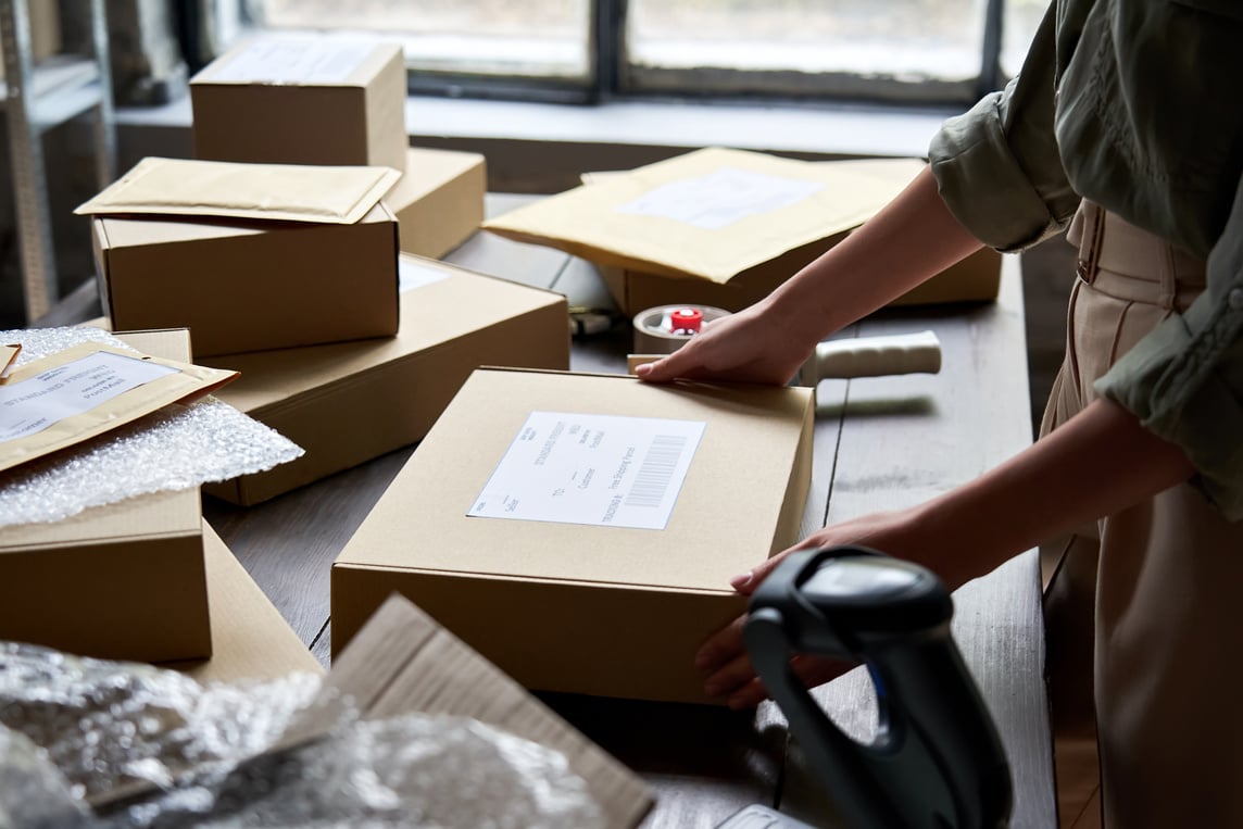 Worker Packing Shipping Order Box for Dispatching